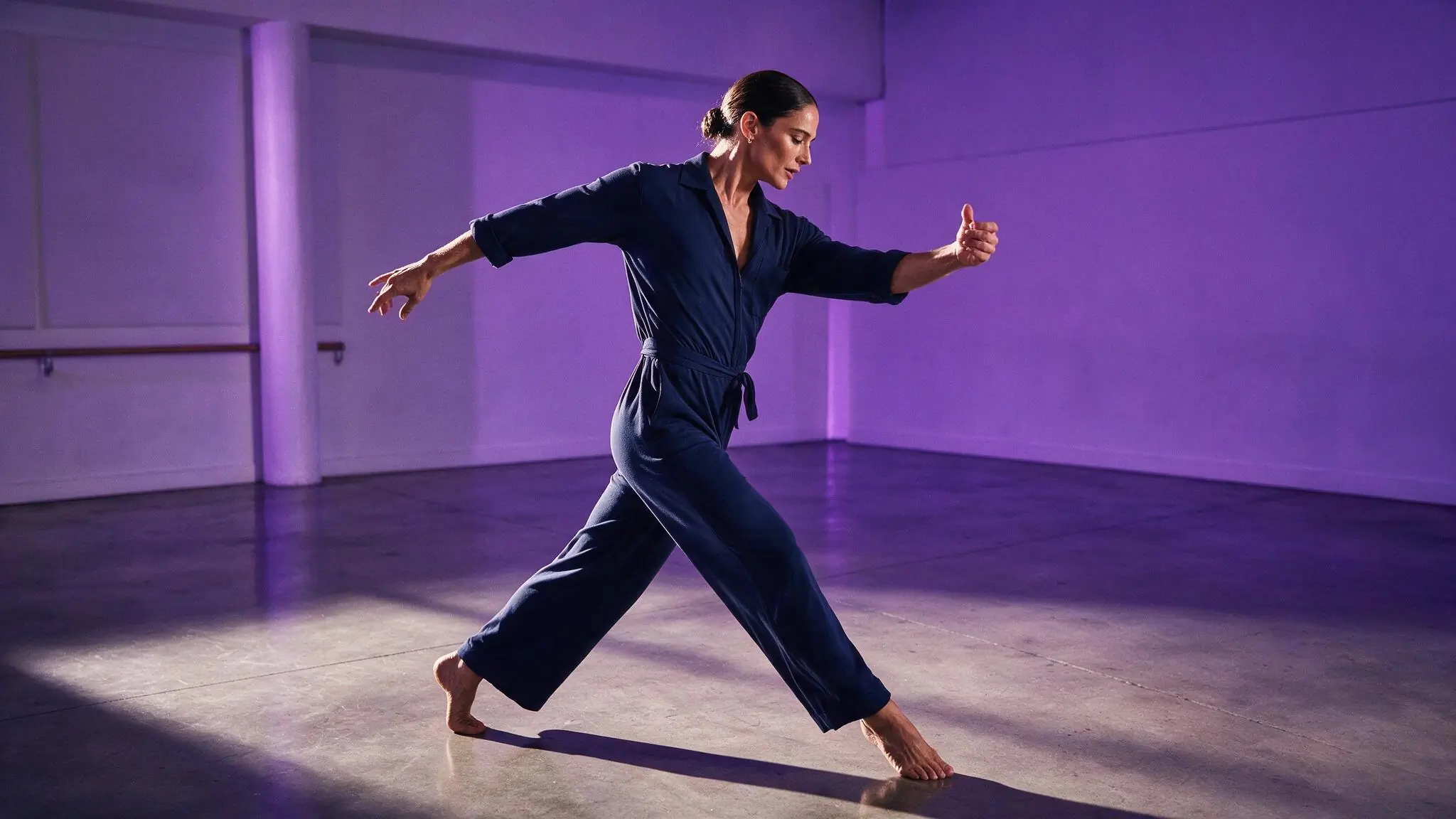 Fictional adult dancer in a violet studio illustrating a side-tracking text-to-video direction